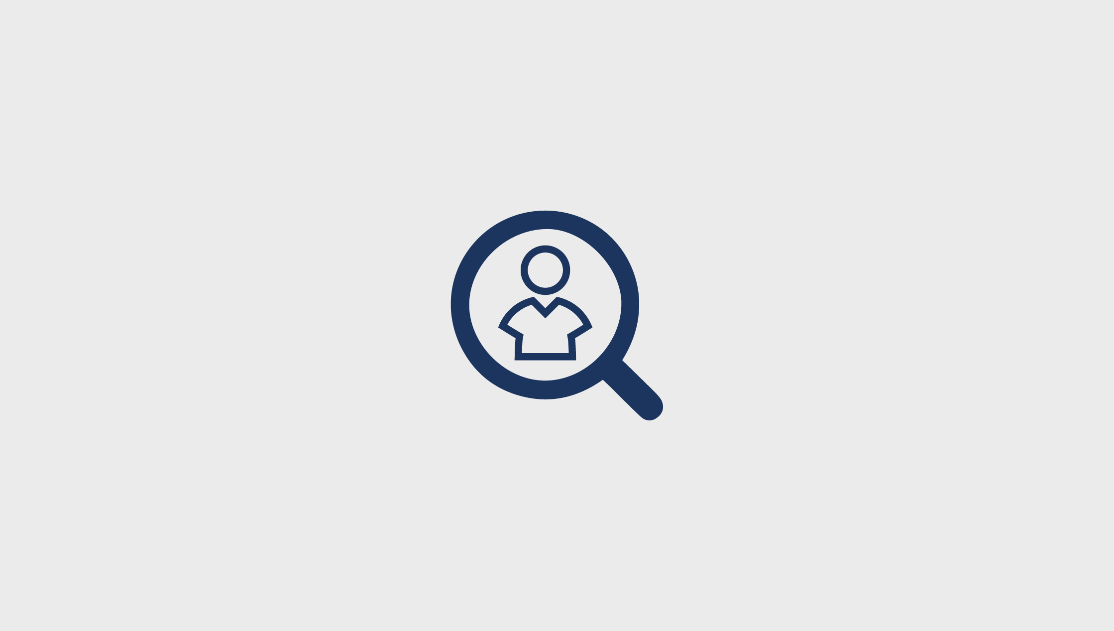 Icon of person in magnifying glass.