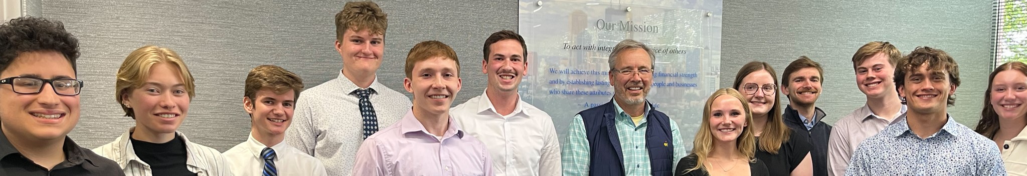 A group of interns with CEO, Rick Long